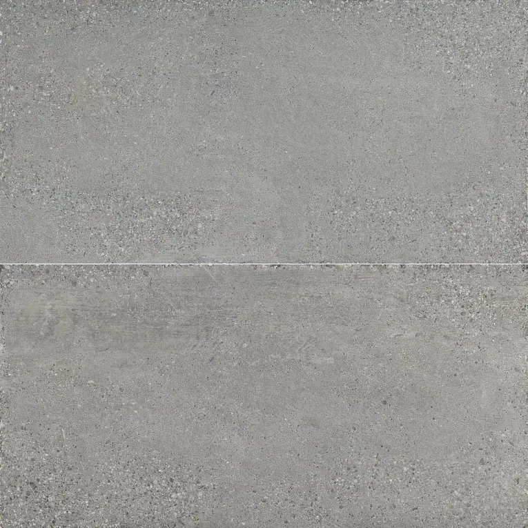A gray tile floor with some white spots on it