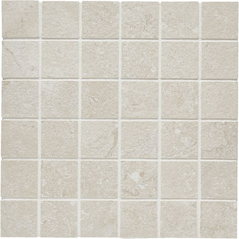 A white tile floor with some small squares