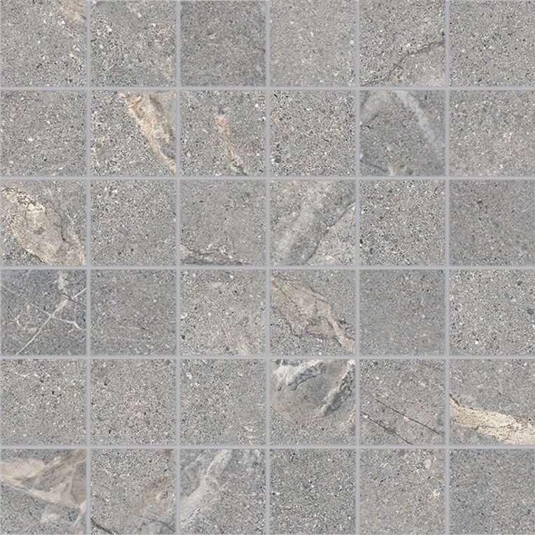 A gray tile floor with some leaves on it