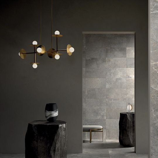 A room with two tables and a mirror