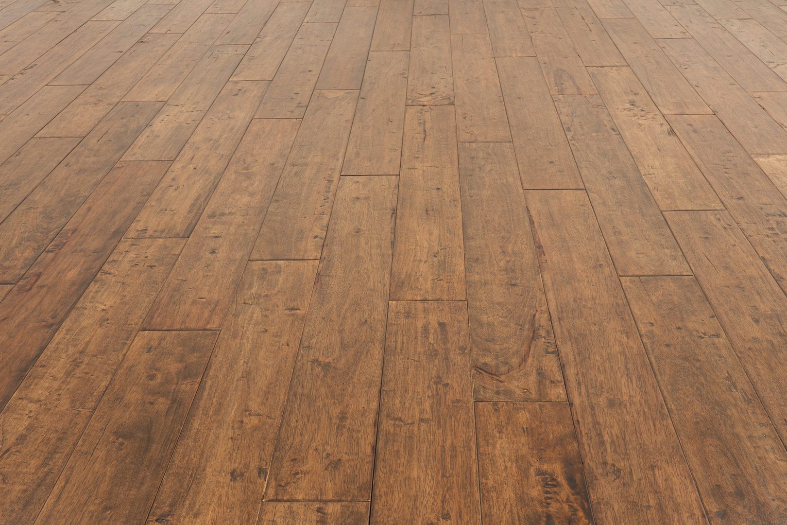 A wooden floor with some brown wood on it
