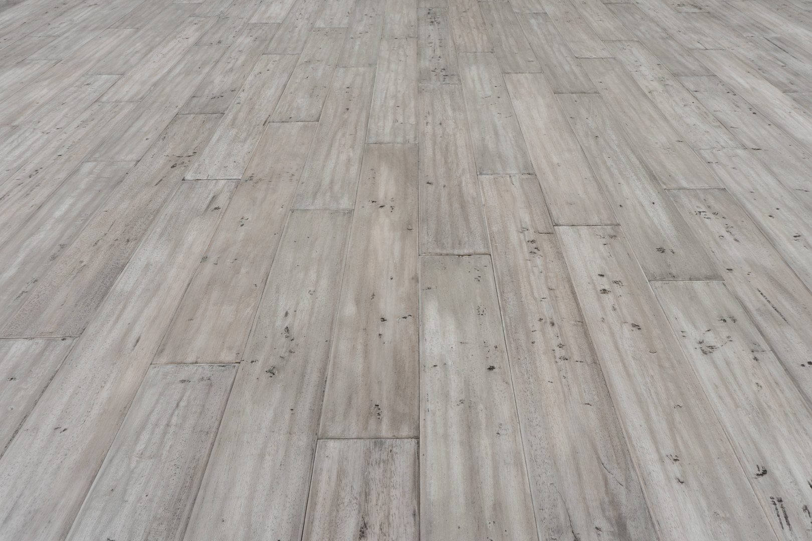 A wooden floor with some wood planks on it