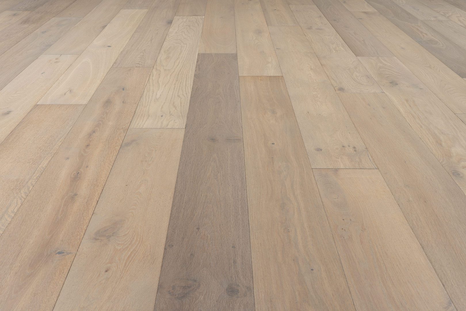 A close up of the wood floor in a room.
