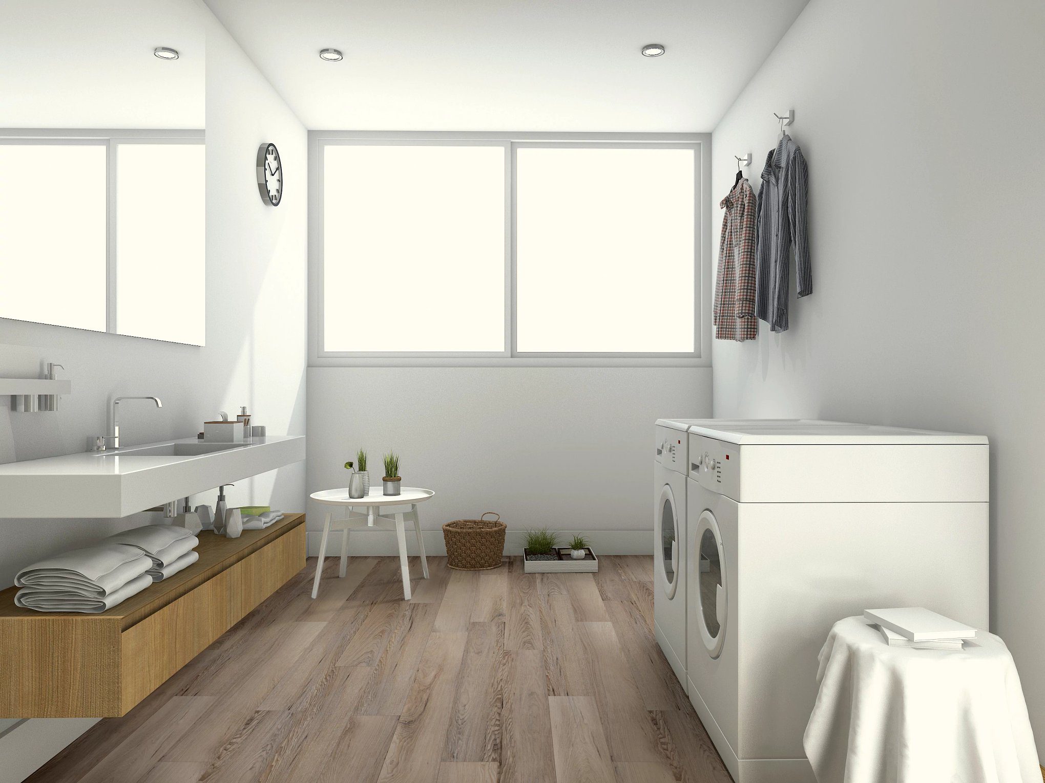A bathroom with a sink, washer and dryer.