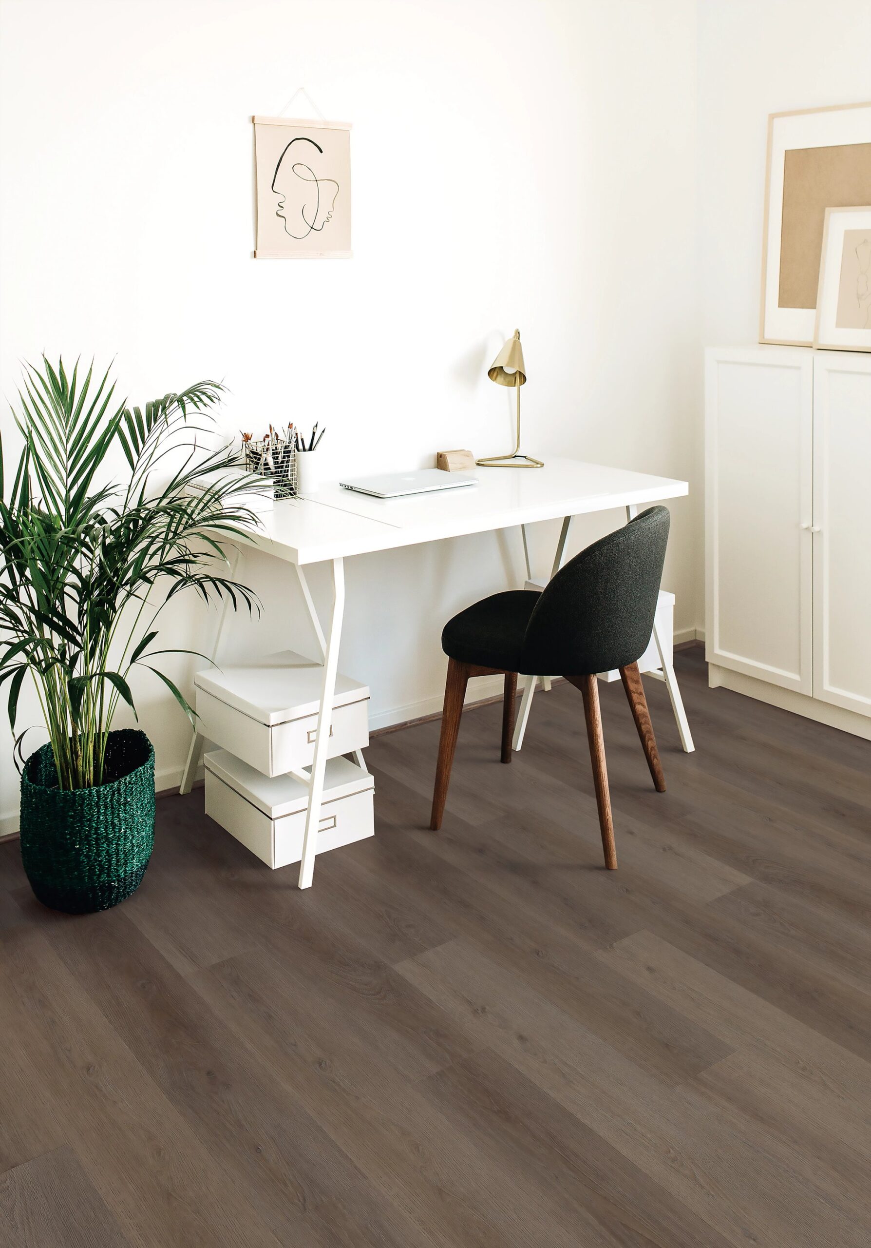 A chair and table in front of a desk.