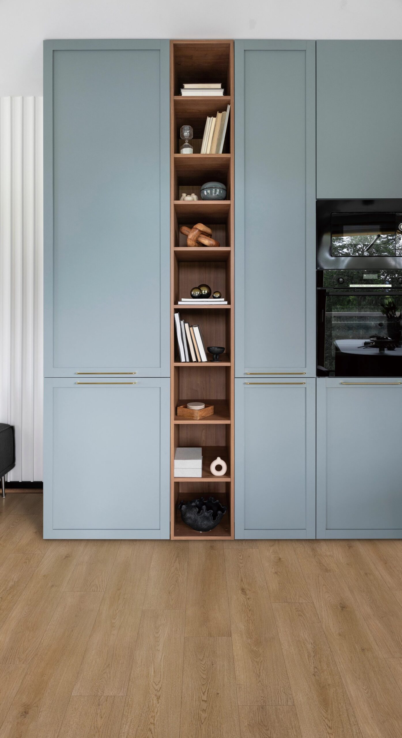 A blue cabinet with a book shelf in the middle
