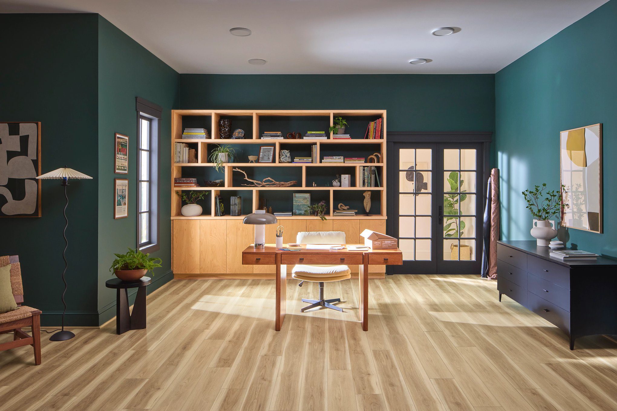 A room with wooden floors and green walls.