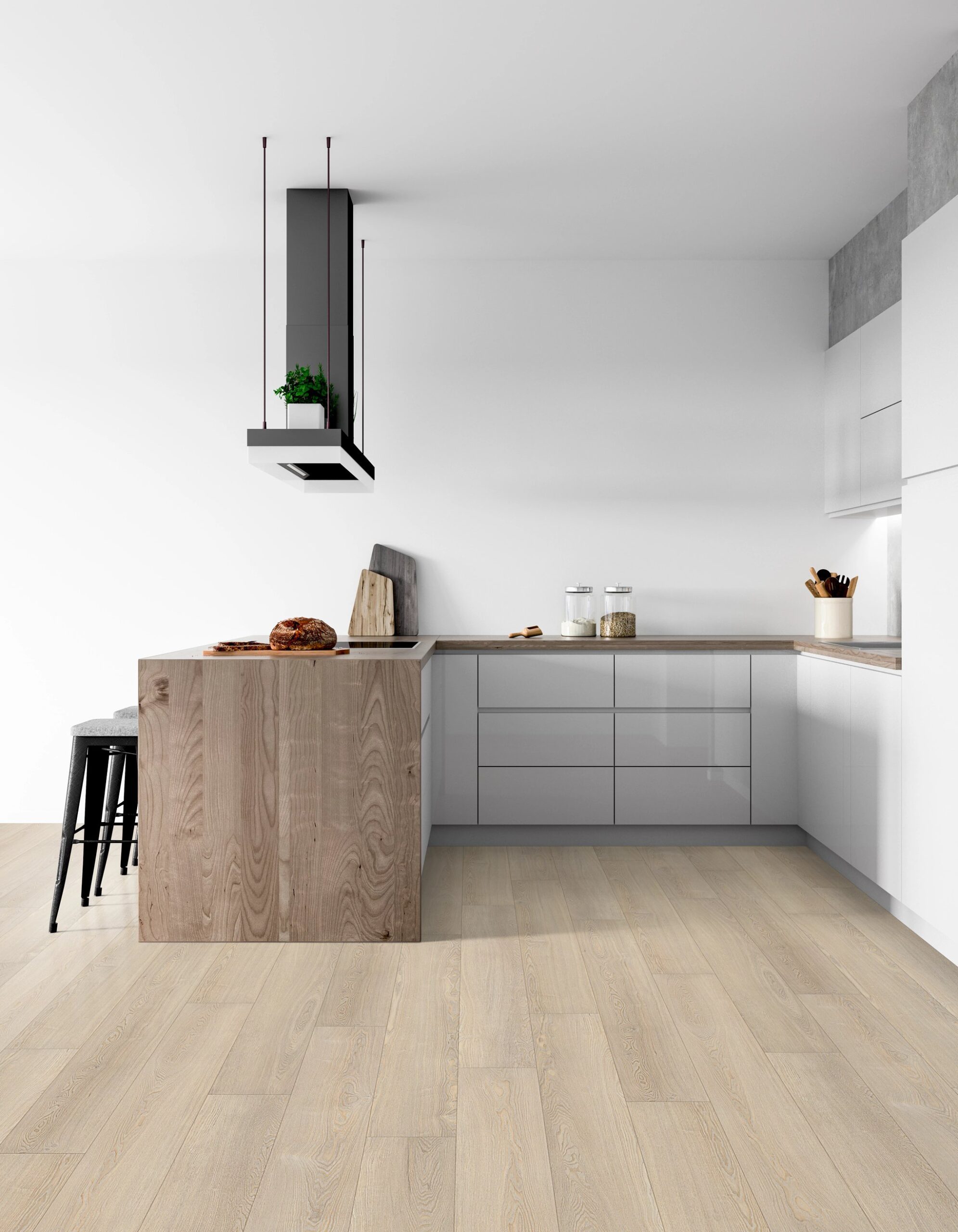 A kitchen with white walls and wooden floors.
