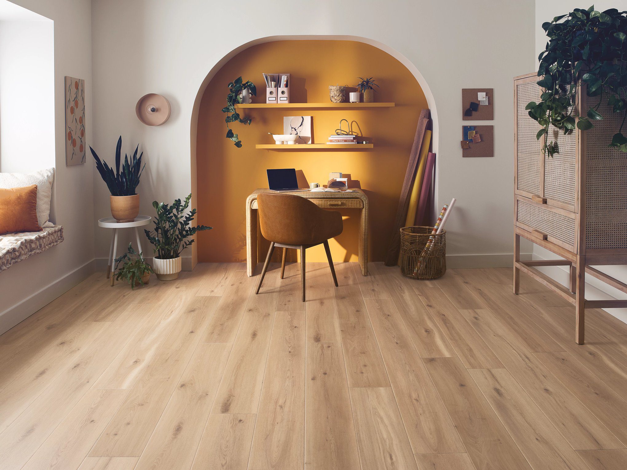 A room with wooden floors and yellow walls.