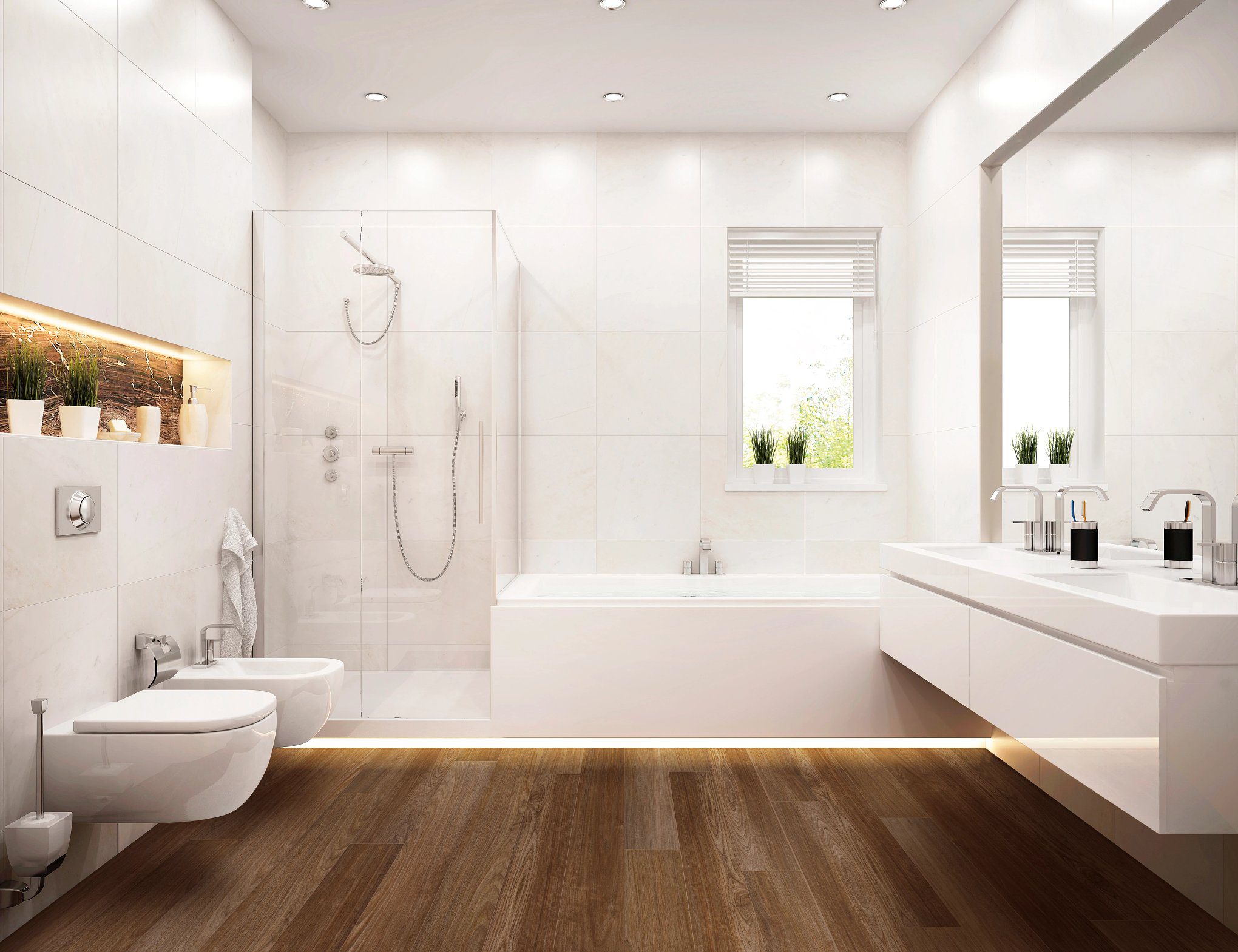 A bathroom with wood floors and white walls.