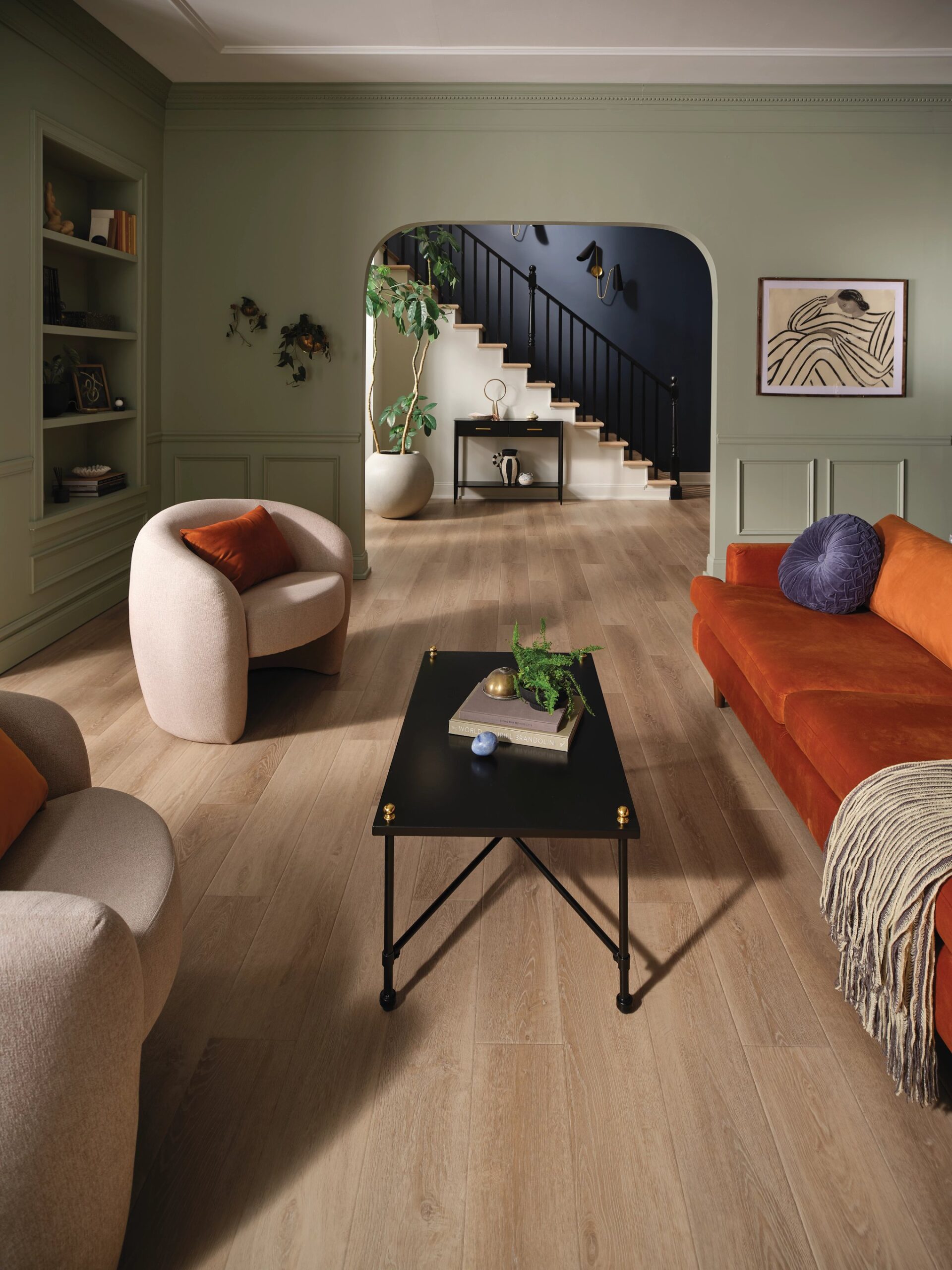 A living room with hard wood floors and furniture.