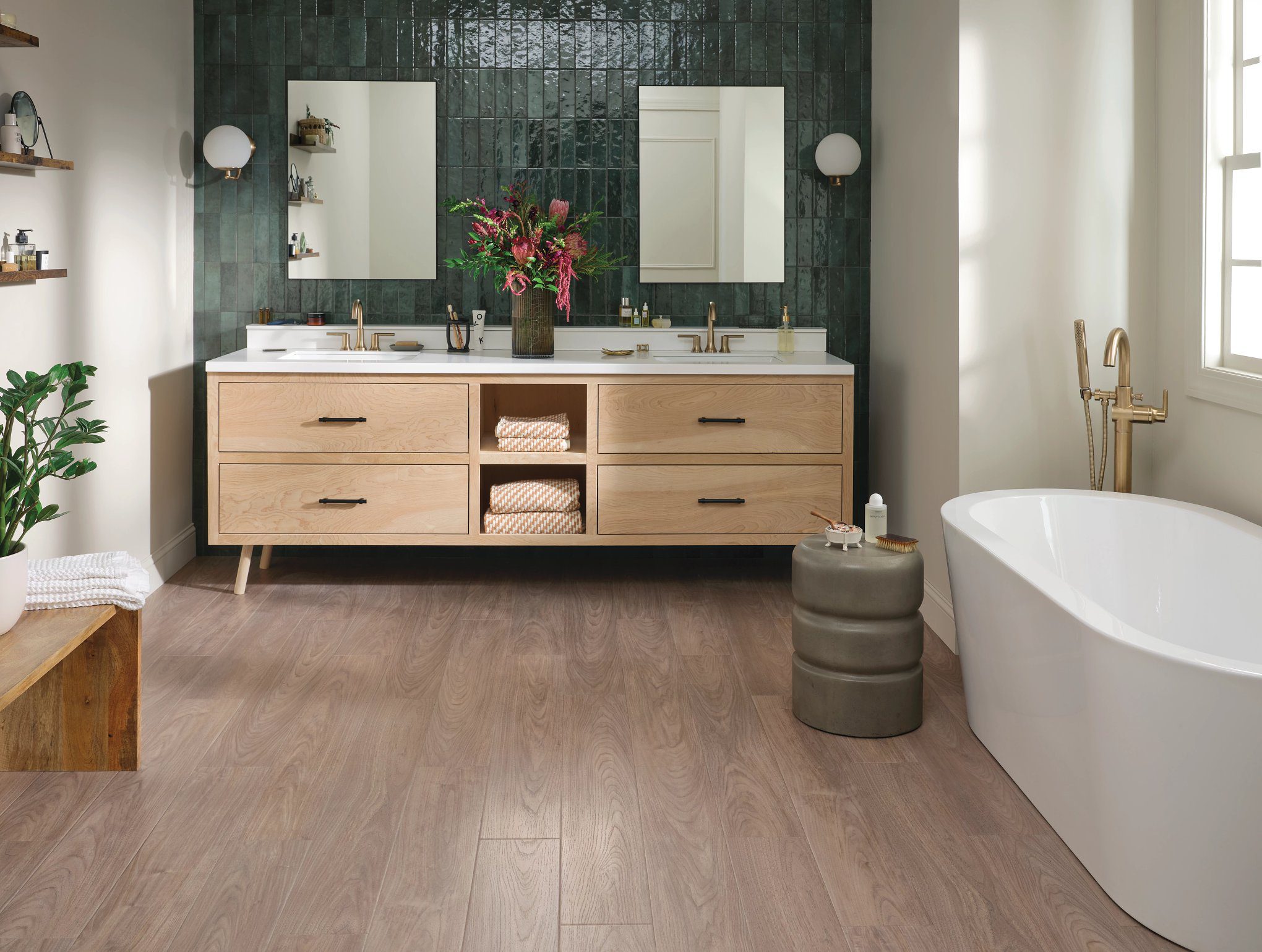 A bathroom with two sinks and a tub.