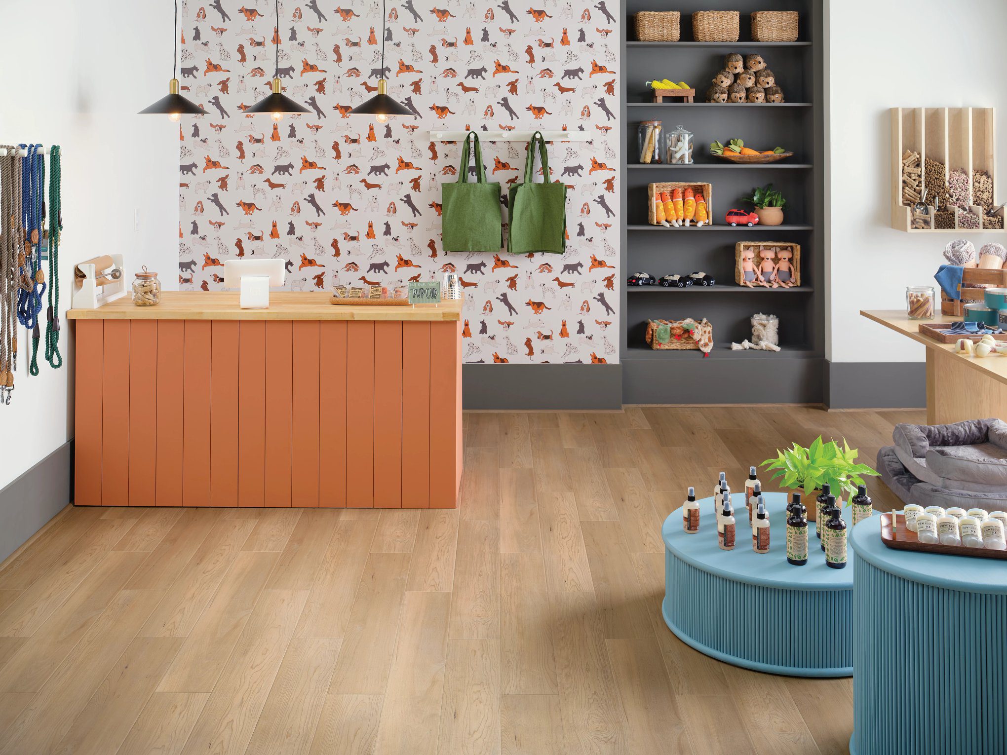 A room with a wall paper and wooden floors