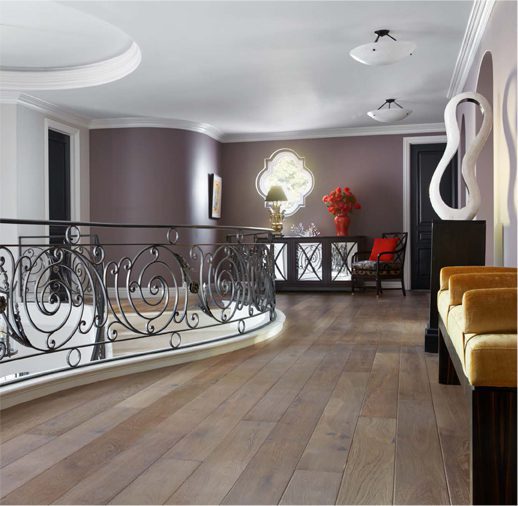 A room with a bench and a railing