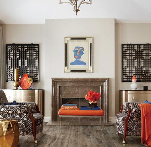 A living room with two chairs and a fireplace