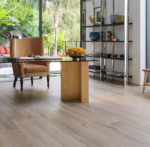 A room with wooden floors and chairs.