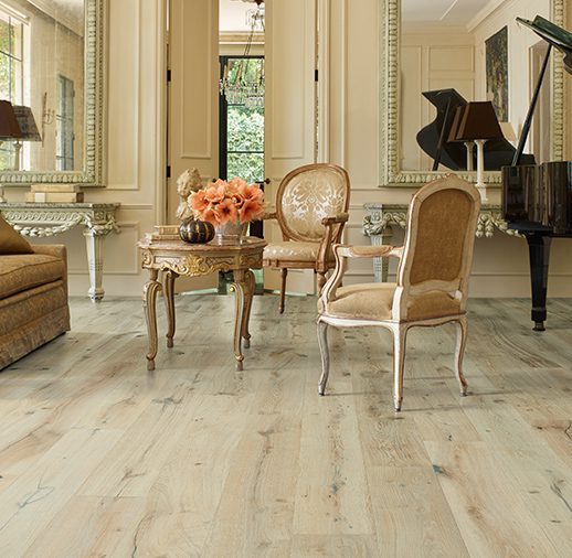 A living room with chairs and a piano