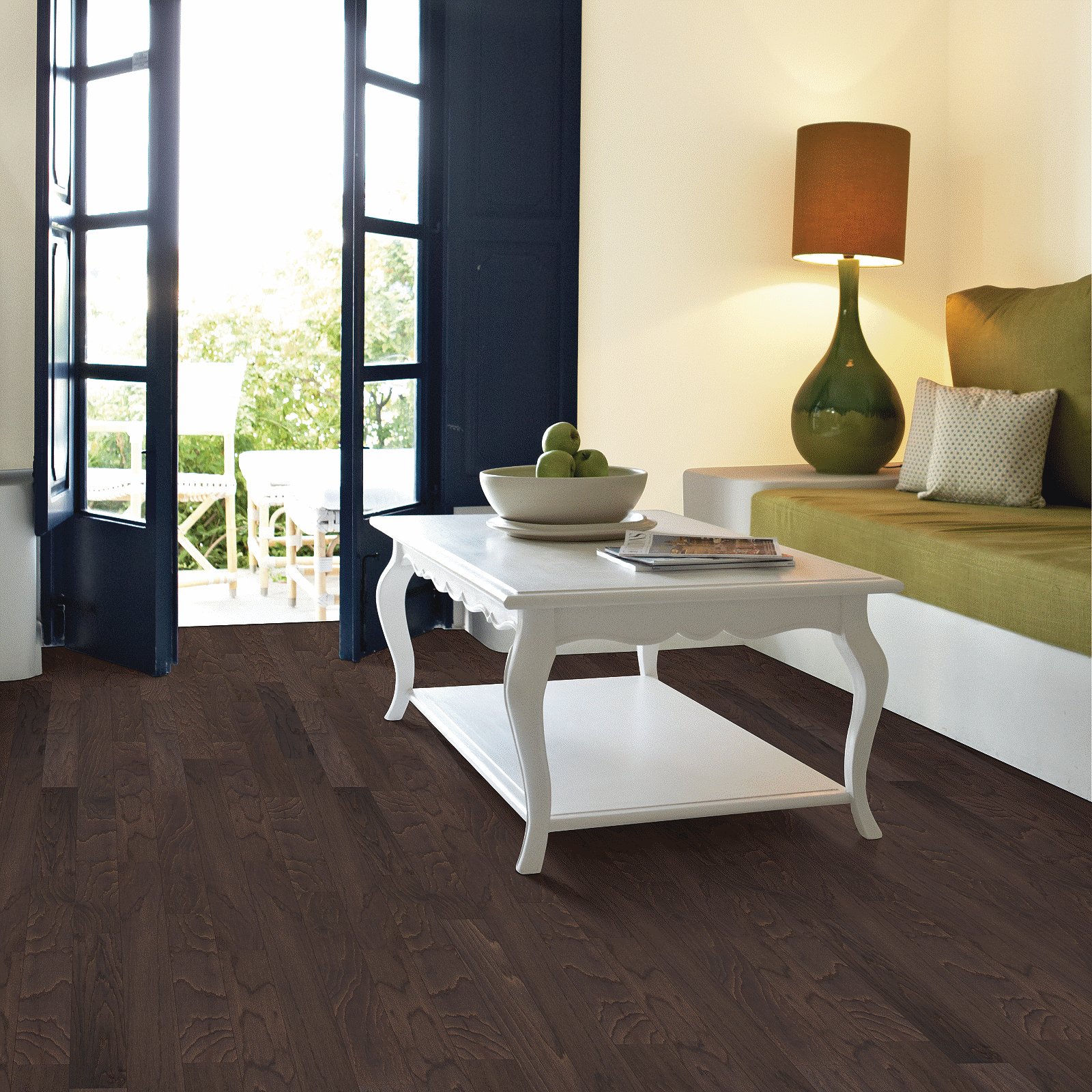 A living room with a white table and green couch.