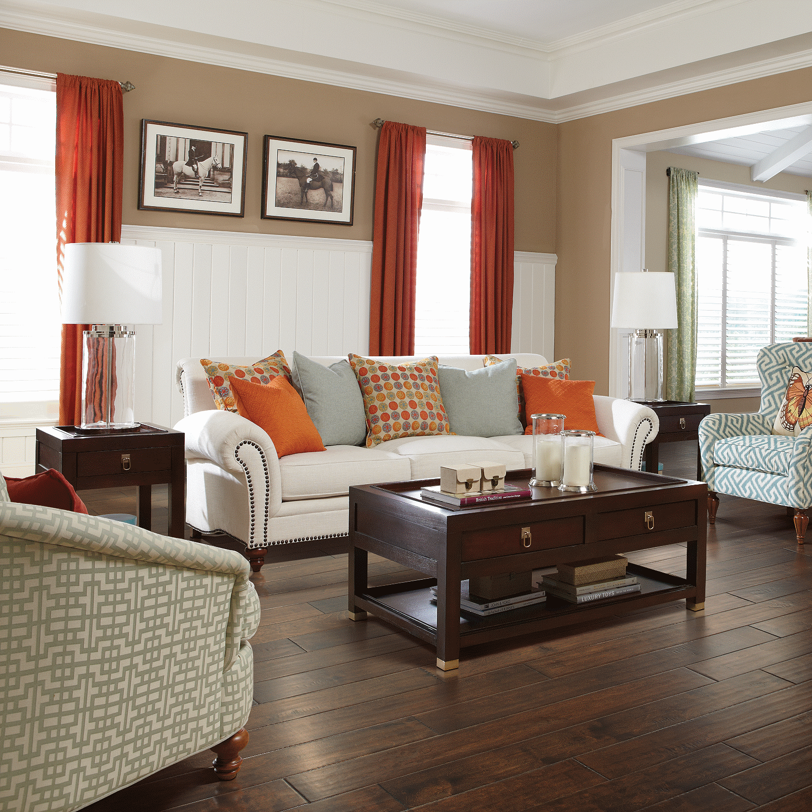 A living room with hardwood floors and furniture.