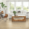 A living room with a couch, chair and coffee table.