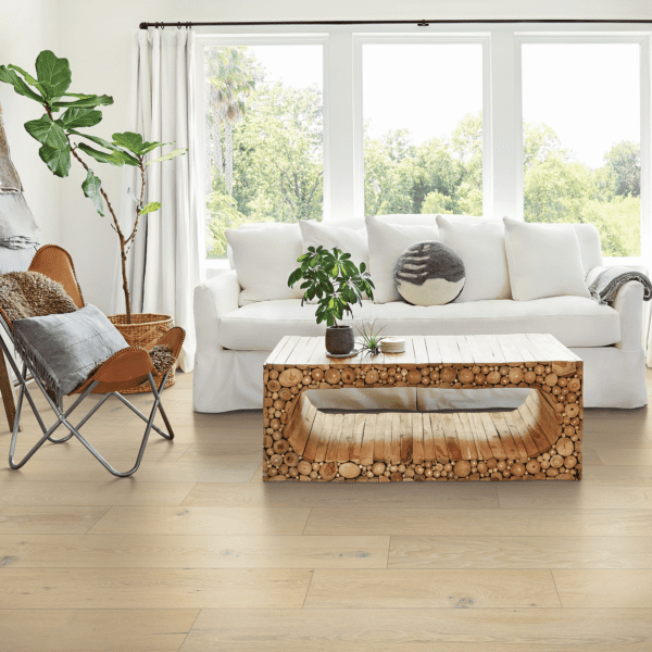 A living room with a couch, chair and coffee table.