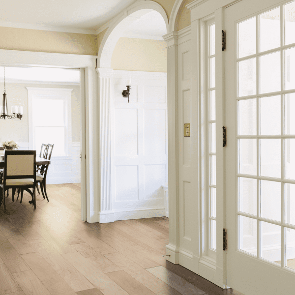 A white door leading to the dining room.