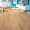 A room with hard wood floors and blue walls.