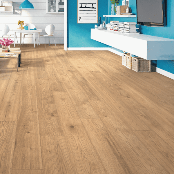 A room with hard wood floors and blue walls.