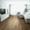 A living room with white furniture and wood floors.