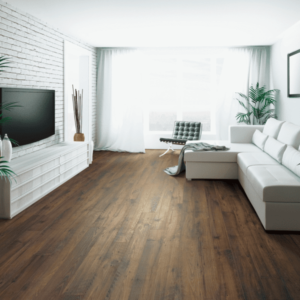 A living room with white furniture and wood floors.