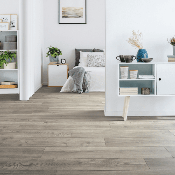 A living room with wooden floors and white walls.