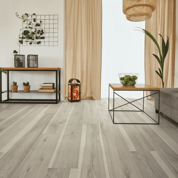 A living room with wooden floors and white walls.