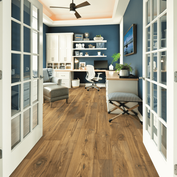 A room with many windows and wooden floors