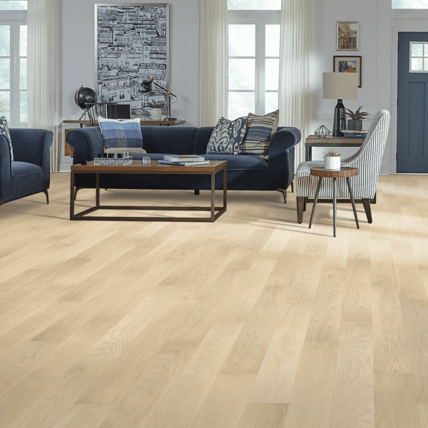 A living room with hard wood floors and furniture.