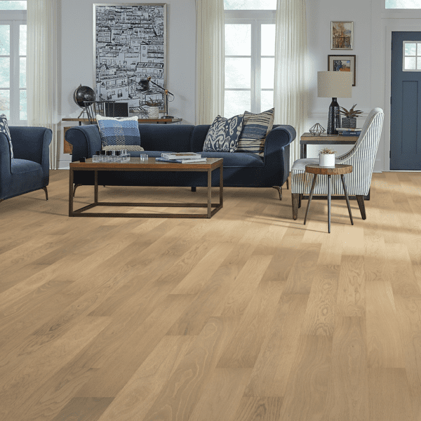 A living room with hard wood floors and furniture.