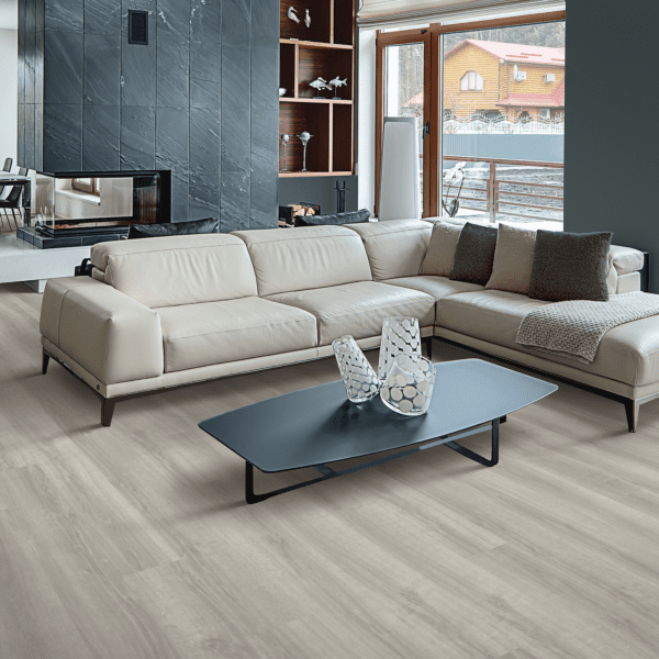 A living room with white furniture and a blue coffee table.