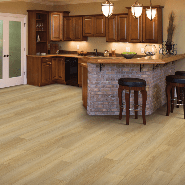 A kitchen with wooden floors and a bar