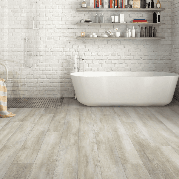 A bathroom with white walls and wooden floors.