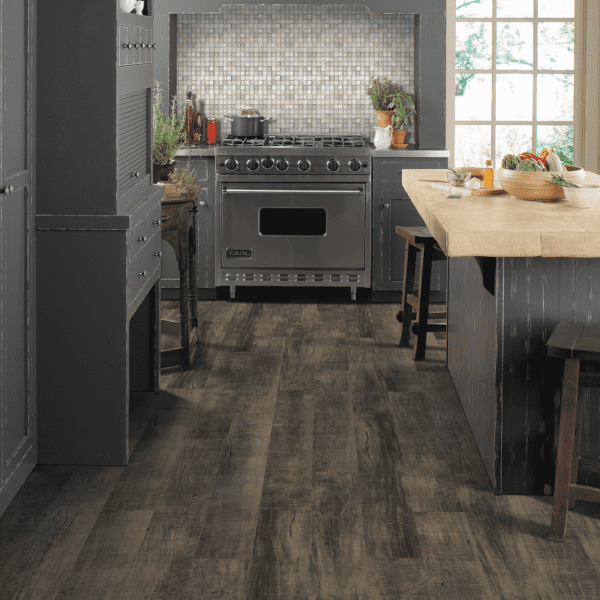 A kitchen with an oven and counter top.