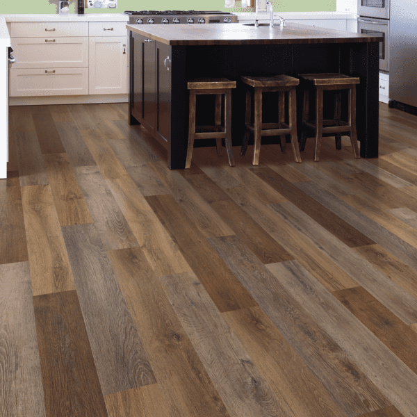 A kitchen with wood flooring and a counter.