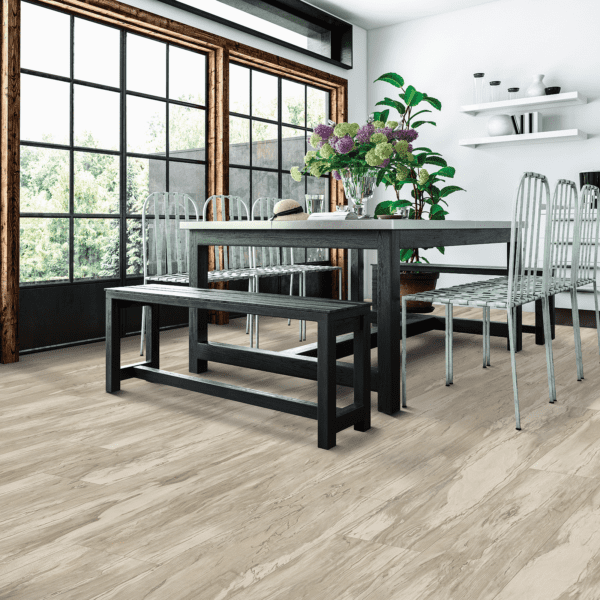 A dining room with a table and chairs, and a bench.