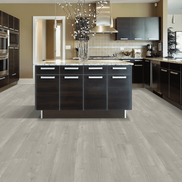 A kitchen with black cabinets and white counters.