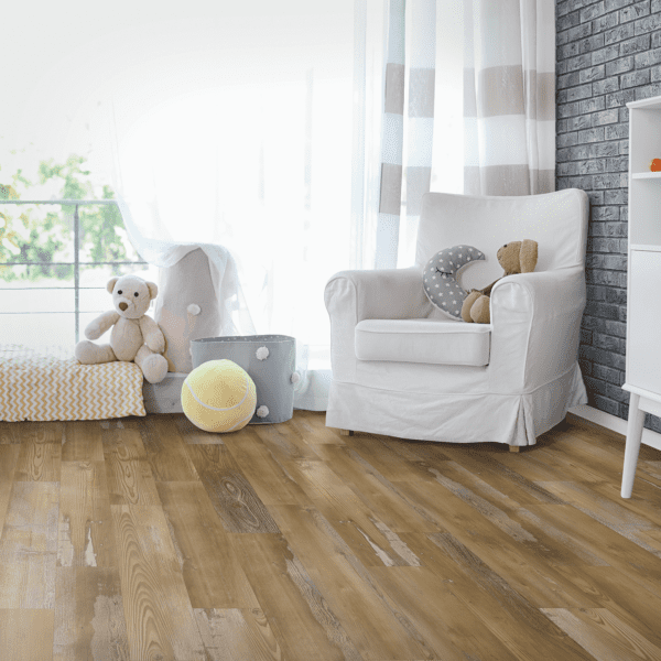 A living room with white furniture and wooden floors.