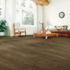 A living room with hard wood floors and furniture.