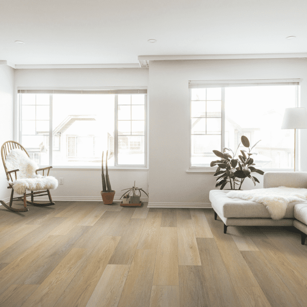 A living room with white walls and wooden floors.