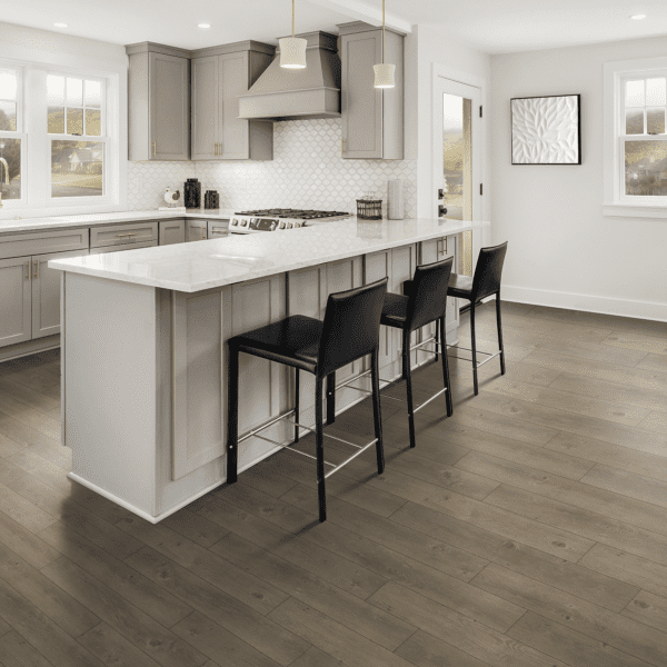 A kitchen with an island and black chairs.