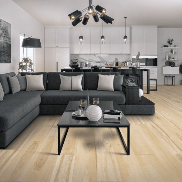 A living room with a couch, coffee table and chairs.