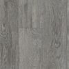 A gray wood floor with some type of pattern