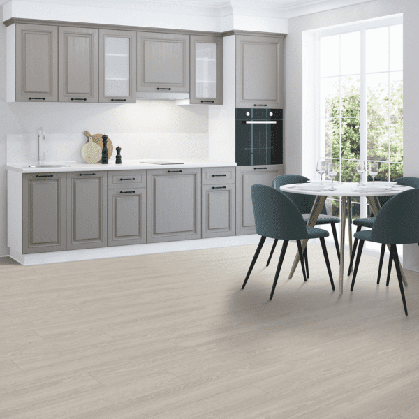 A kitchen with grey cabinets and white counters.