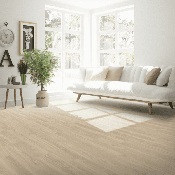 A living room with white furniture and wooden floors.